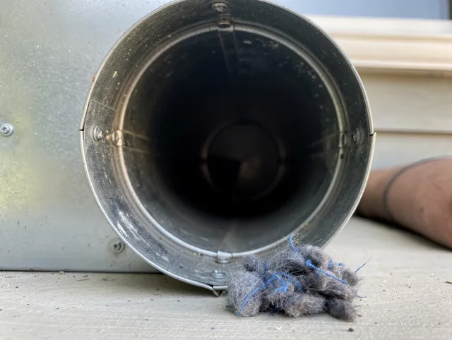 Gardena Dryer Vent Cleaning technician using specialized equipment to clear severe dryer vent blockage in Gardena